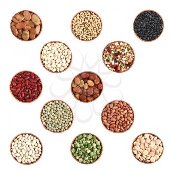 variety of beans in a wooden bowl on a white background