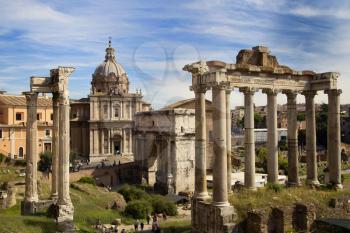 Beautiful view of The Roman Forum surrounded by the ruins of several important ancient government buildings at the center of the city of Rome, Italy