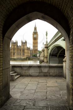 Westminster parliament through an arch in London, UK