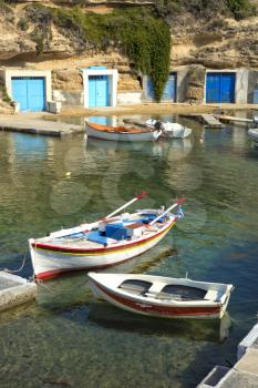 Mandrakia village, the architecture of this picturesque village is traditional of Milos,   These houses are used by fishers for the housing of the fishing boats and the nets