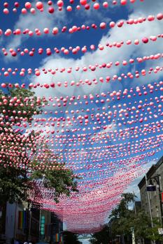 Montreal, Quebec, Canada - August 23, 2016: Pink balls is an annual installation that takes place during the Montreal summer in the Gay area.