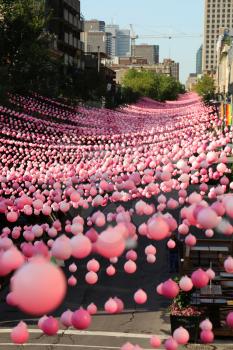Montreal, Quebec, Canada - August 23, 2016: Pink balls is an annual installation that takes place during the Montreal summer in the Gay area.