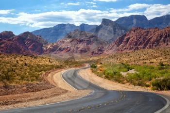 Road into Red Rock Canyon in Nevada with mountains in background