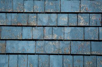 Grunge blue tiles wall of an old house