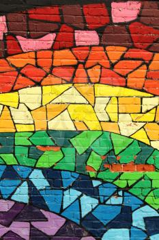 MONTREAL, CANADA-AUGUST 20th, 2014:  Rainbow stained glass pattern graffiti on a wall into the gay area in Montreal, Canada