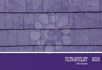 Grunge violet tiles wall of an old house.   Color of the year, ultraviolet.