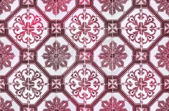 Photograph of traditional portuguese tiles in red and burgundy