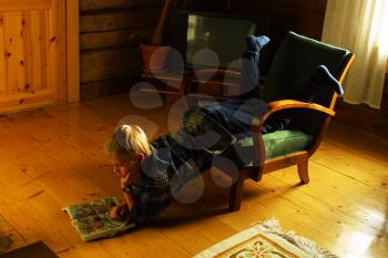 Royalty Free Photo of a Little Boy Reading