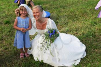 Royalty Free Photo of a Bride and Little Girl