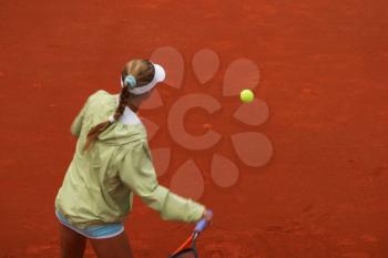 Royalty Free Photo of a Girl Playing Tennis