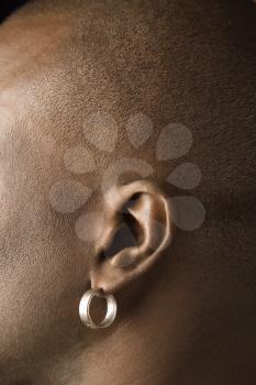 Royalty Free Photo of a Side View Portrait of a Man Wearing an Earring