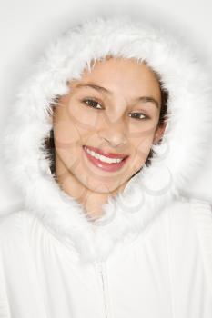 Royalty Free Photo of a Teen Girl Wearing a Fur Lined Coat Hood and Smiling