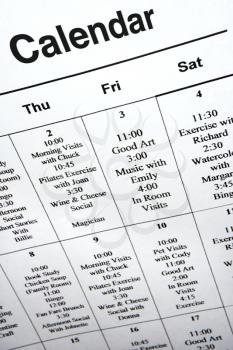 Close-up of calendar of events at retirement community center.