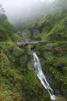 Royalty Free Photo of a Waterfall on the Road to Hana, Hana Highway, Hawaii, USA
