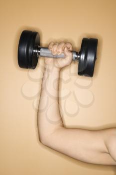 Royalty Free Photo of a Woman Holding Up a Weight
