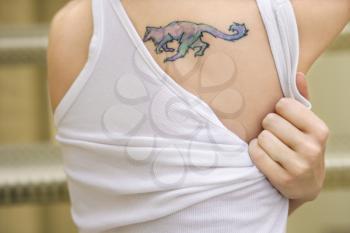 Royalty Free Photo of a Portrait of a Woman With a Tattoo on Her Shoulder