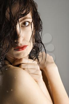 Royalty Free Photo of a Portrait of a Redheaded Young Woman With Wet Hair and Skin