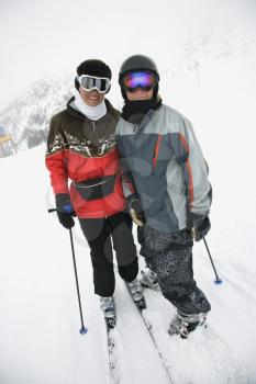 Royalty Free Photo of a Mother With Her Teenage Son on Snowy Ski Slopes