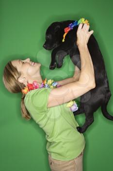Royalty Free Photo of a Woman Holding a Puppy