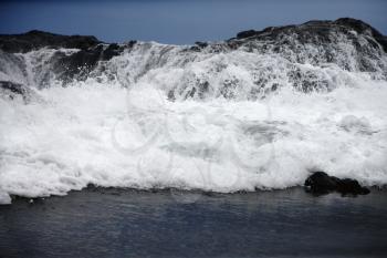 Royalty Free Photo of a Landscape of Waves Crashing into a Rocky Maui Hawaii Coast