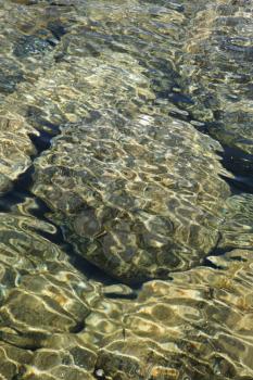 Royalty Free Photo of Rocks in Rippled Water in Maui, Hawaii