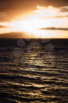 Royalty Free Photo of a Sunset View of the Ocean and Kihei Island in Maui, Hawaii, USA
