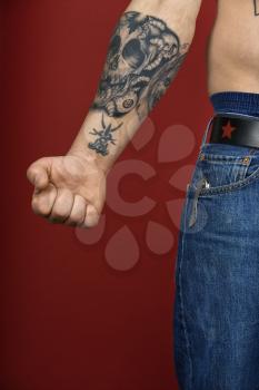 Royalty Free Photo of a Man's Arm With a Tattoo