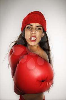 Royalty Free Photo of a Woman Wearing Boxing Gloves and a Hat