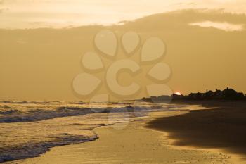Royalty Free Photo of a Golden Beach at Sunset