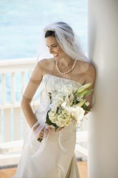 Royalty Free Photo of a Bride Holding a Bouquet 