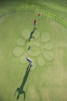 Royalty Free Photo of an Aerial View of an Excited Man and Woman on a Golf Course at Bald Head Island, North Carolina