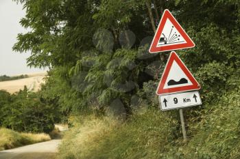 Royalty Free Photo of Road Sign Warnings, Tuscany