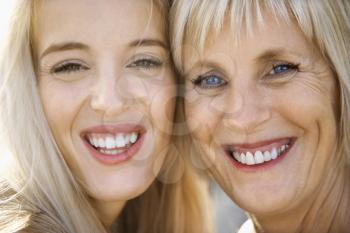 Royalty Free Photo of a Mother and Daughter Smiling and Laughing
