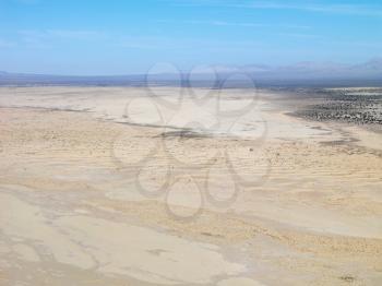 Royalty Free Photo of an Aerial View of a Remote California Desert With Mountain Range in the Background