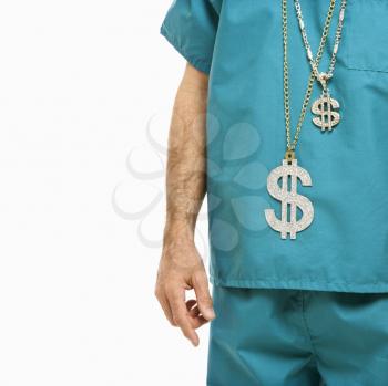Royalty Free Photo of a Male Doctor With Two Dollar Sign Necklaces