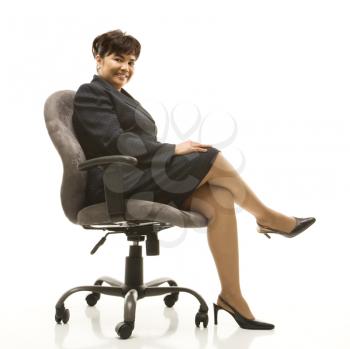 Royalty Free Photo of a Businesswoman Sitting in a Office Chair