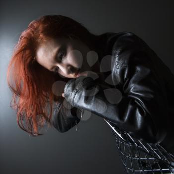 Royalty Free Photo of a Redheaded Woman Wearing a Leather Jacket 