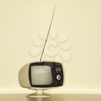Royalty Free Photo of a Vintage Television With Antenna Raised