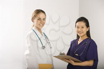 Royalty Free Photo of a Female Doctor and Physician's Assistant