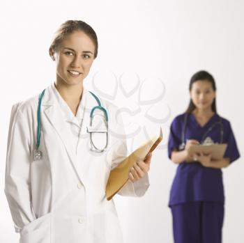 Royalty Free Photo of a Female Doctor and Physician's Assistant