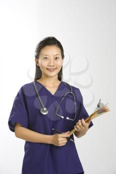 Royalty Free Photo of a Female Doctor Holding Files