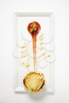 Royalty Free Photo of an Apple Stilton Tart With Glazed Walnuts and Caramel