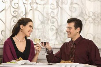 Royalty Free Photo of a Couple Toasting Their Classes of Wine