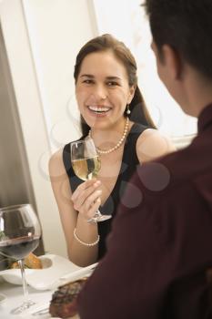 Royalty Free Photo of a Couple Dining in a Restaurant and Smiling
