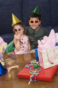Royalty Free Photo of a Brother and Sister Having a Birthday Party