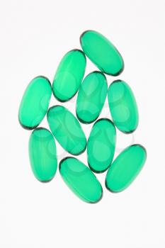 Royalty Free Photo of Green Capsule Pills Against a White Background