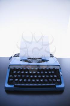 Royalty Free Photo of a Blank Sheet of a Paper in an Old Fashioned Typewriter