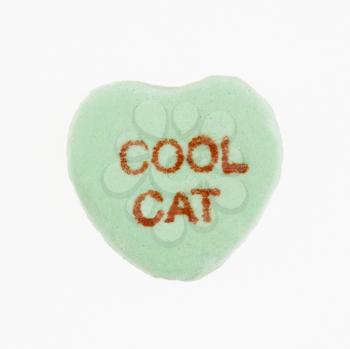 Royalty Free Photo of a Green Candy Heart That Reads Cool Cat