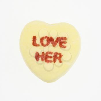 Royalty Free Photo of a Yellow Candy Heart That Reads Love Her