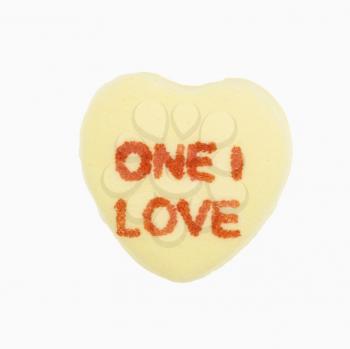 Royalty Free Photo of a Yellow Candy Heart That Reads One I Love